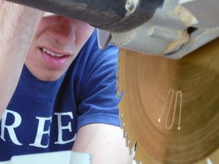 young man working with tablesaw